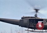 Image of Soldiers landing at Camp Evans from UH-1D helicopter A Shau Valley Vietnam, 1968, second 56 stock footage video 65675026856