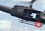 Image of Soldiers landing at Camp Evans from UH-1D helicopter A Shau Valley Vietnam, 1968, second 57 stock footage video 65675026856