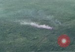 Image of UH-1Ds helicopters flying over the mountains A Shau Valley Vietnam, 1968, second 1 stock footage video 65675026857