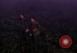 Image of UH-1Ds helicopters flying over the mountains A Shau Valley Vietnam, 1968, second 24 stock footage video 65675026857