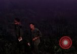 Image of UH-1Ds helicopters flying over the mountains A Shau Valley Vietnam, 1968, second 25 stock footage video 65675026857