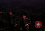 Image of UH-1Ds helicopters flying over the mountains A Shau Valley Vietnam, 1968, second 26 stock footage video 65675026857