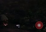 Image of UH-1Ds helicopters flying over the mountains A Shau Valley Vietnam, 1968, second 30 stock footage video 65675026857