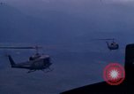 Image of UH-1Ds helicopters flying over the mountains A Shau Valley Vietnam, 1968, second 52 stock footage video 65675026857