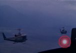 Image of UH-1Ds helicopters flying over the mountains A Shau Valley Vietnam, 1968, second 53 stock footage video 65675026857