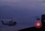 Image of UH-1Ds helicopters flying over the mountains A Shau Valley Vietnam, 1968, second 54 stock footage video 65675026857