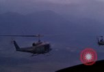 Image of UH-1Ds helicopters flying over the mountains A Shau Valley Vietnam, 1968, second 57 stock footage video 65675026857