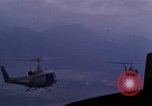 Image of UH-1Ds helicopters flying over the mountains A Shau Valley Vietnam, 1968, second 60 stock footage video 65675026857