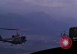 Image of UH-1Ds helicopters flying over the mountains A Shau Valley Vietnam, 1968, second 61 stock footage video 65675026857