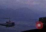 Image of UH-1Ds helicopters flying over the mountains A Shau Valley Vietnam, 1968, second 62 stock footage video 65675026857