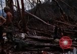 Image of Wrecked US Army UH-1H helicopter A Shau Valley Vietnam, 1968, second 12 stock footage video 65675026858