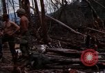 Image of Wrecked US Army UH-1H helicopter A Shau Valley Vietnam, 1968, second 13 stock footage video 65675026858