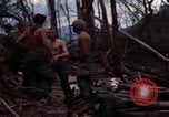 Image of Wrecked US Army UH-1H helicopter A Shau Valley Vietnam, 1968, second 15 stock footage video 65675026858