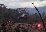 Image of Wrecked US Army UH-1H helicopter A Shau Valley Vietnam, 1968, second 17 stock footage video 65675026858
