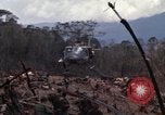 Image of Wrecked US Army UH-1H helicopter A Shau Valley Vietnam, 1968, second 18 stock footage video 65675026858