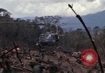 Image of Wrecked US Army UH-1H helicopter A Shau Valley Vietnam, 1968, second 19 stock footage video 65675026858