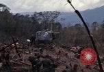 Image of Wrecked US Army UH-1H helicopter A Shau Valley Vietnam, 1968, second 21 stock footage video 65675026858