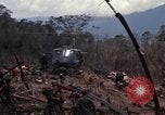 Image of Wrecked US Army UH-1H helicopter A Shau Valley Vietnam, 1968, second 23 stock footage video 65675026858