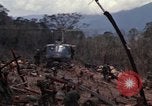 Image of Wrecked US Army UH-1H helicopter A Shau Valley Vietnam, 1968, second 24 stock footage video 65675026858