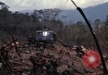 Image of Wrecked US Army UH-1H helicopter A Shau Valley Vietnam, 1968, second 25 stock footage video 65675026858