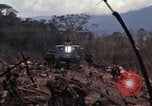 Image of Wrecked US Army UH-1H helicopter A Shau Valley Vietnam, 1968, second 26 stock footage video 65675026858