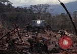 Image of Wrecked US Army UH-1H helicopter A Shau Valley Vietnam, 1968, second 28 stock footage video 65675026858