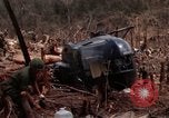 Image of Wrecked US Army UH-1H helicopter A Shau Valley Vietnam, 1968, second 31 stock footage video 65675026858
