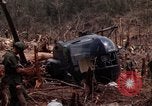 Image of Wrecked US Army UH-1H helicopter A Shau Valley Vietnam, 1968, second 32 stock footage video 65675026858