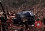 Image of Wrecked US Army UH-1H helicopter A Shau Valley Vietnam, 1968, second 33 stock footage video 65675026858