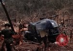 Image of Wrecked US Army UH-1H helicopter A Shau Valley Vietnam, 1968, second 34 stock footage video 65675026858