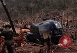 Image of Wrecked US Army UH-1H helicopter A Shau Valley Vietnam, 1968, second 35 stock footage video 65675026858