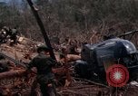 Image of Wrecked US Army UH-1H helicopter A Shau Valley Vietnam, 1968, second 39 stock footage video 65675026858