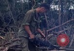 Image of Wrecked US Army UH-1H helicopter A Shau Valley Vietnam, 1968, second 55 stock footage video 65675026858