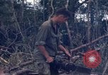 Image of Wrecked US Army UH-1H helicopter A Shau Valley Vietnam, 1968, second 58 stock footage video 65675026858