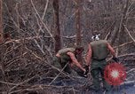 Image of Wrecked US Army UH-1H helicopter A Shau Valley Vietnam, 1968, second 62 stock footage video 65675026858