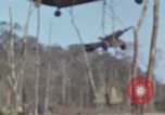 Image of Soldiers struggling to position 105mm Howitzer A Shau Valley Vietnam, 1968, second 7 stock footage video 65675026860