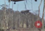 Image of Soldiers struggling to position 105mm Howitzer A Shau Valley Vietnam, 1968, second 9 stock footage video 65675026860
