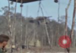 Image of Soldiers struggling to position 105mm Howitzer A Shau Valley Vietnam, 1968, second 10 stock footage video 65675026860