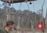 Image of Soldiers struggling to position 105mm Howitzer A Shau Valley Vietnam, 1968, second 12 stock footage video 65675026860