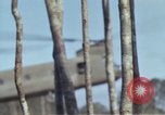 Image of Soldiers struggling to position 105mm Howitzer A Shau Valley Vietnam, 1968, second 30 stock footage video 65675026860