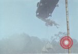 Image of Soldiers struggling to position 105mm Howitzer A Shau Valley Vietnam, 1968, second 52 stock footage video 65675026860