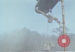 Image of Soldiers struggling to position 105mm Howitzer A Shau Valley Vietnam, 1968, second 54 stock footage video 65675026860