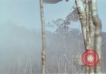 Image of Soldiers struggling to position 105mm Howitzer A Shau Valley Vietnam, 1968, second 59 stock footage video 65675026860