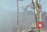 Image of Soldiers struggling to position 105mm Howitzer A Shau Valley Vietnam, 1968, second 60 stock footage video 65675026860