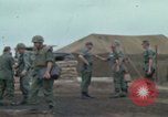 Image of Gen William C Westmoreland in conversation and departure in helicopter A Shau Valley Vietnam, 1968, second 5 stock footage video 65675026863