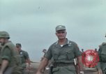Image of Gen William C Westmoreland in conversation and departure in helicopter A Shau Valley Vietnam, 1968, second 7 stock footage video 65675026863