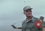 Image of Gen William C Westmoreland in conversation and departure in helicopter A Shau Valley Vietnam, 1968, second 9 stock footage video 65675026863