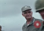 Image of Gen William C Westmoreland in conversation and departure in helicopter A Shau Valley Vietnam, 1968, second 10 stock footage video 65675026863