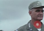 Image of Gen William C Westmoreland in conversation and departure in helicopter A Shau Valley Vietnam, 1968, second 11 stock footage video 65675026863