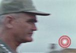 Image of Gen William C Westmoreland in conversation and departure in helicopter A Shau Valley Vietnam, 1968, second 12 stock footage video 65675026863